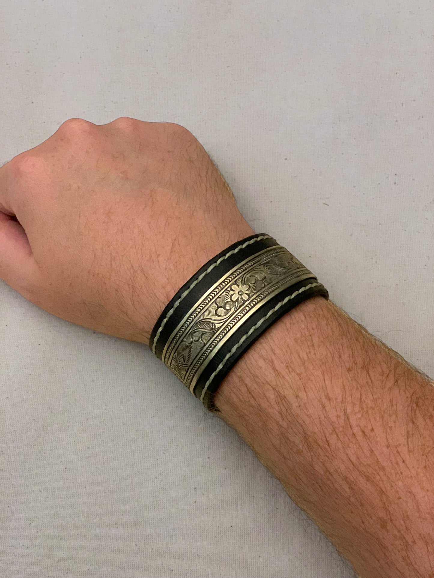 Black Leather Cuff with Intricate Metal Engraving