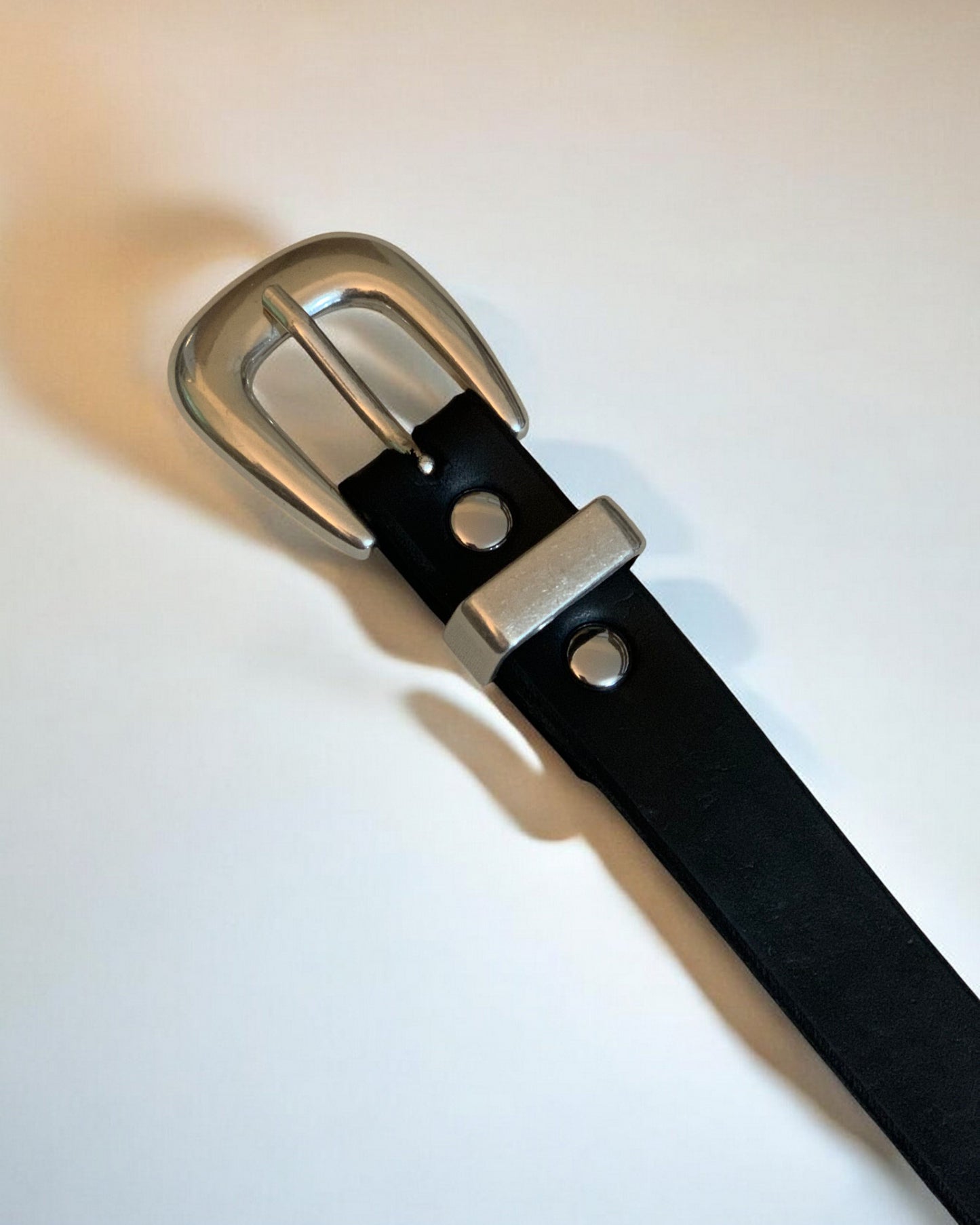 Smooth Silver Buckle on Leather Belt