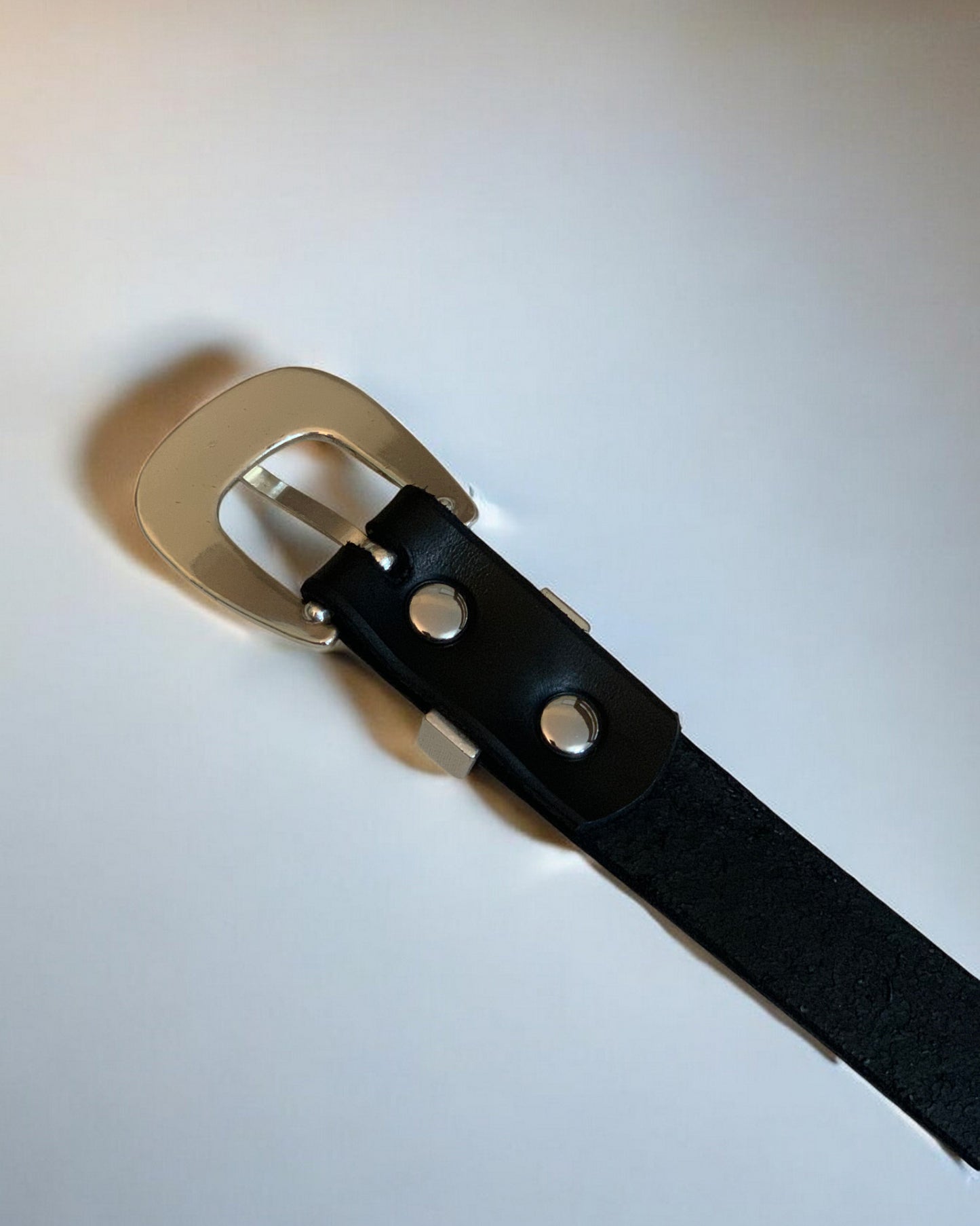 Smooth Silver Buckle on Leather Belt