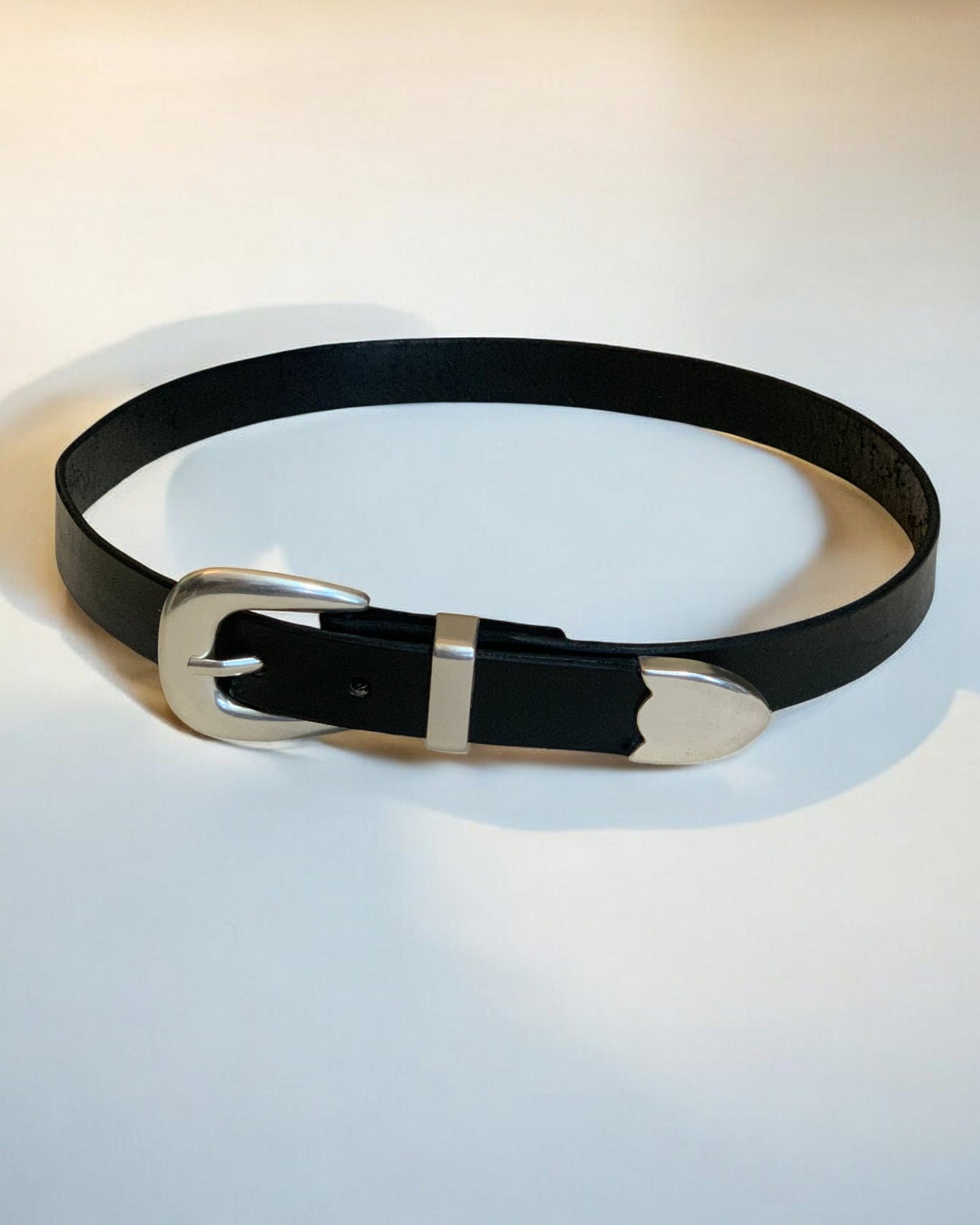 Smooth Silver Buckle on Leather Belt