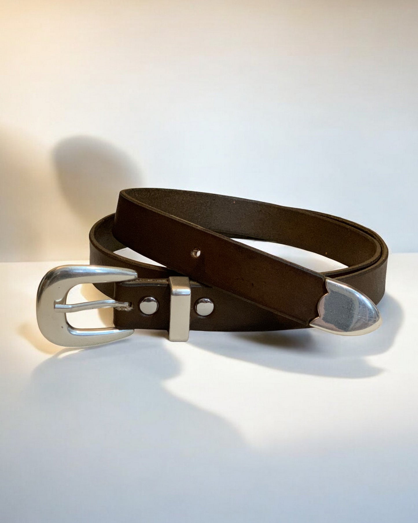 Smooth Silver Buckle on Leather Belt